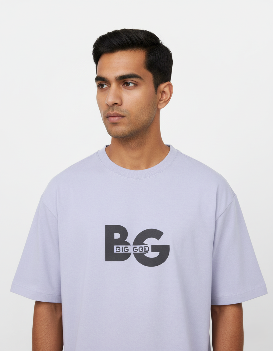 Man wearing a light Lavender t-shirt with 'BIG GOD' logo