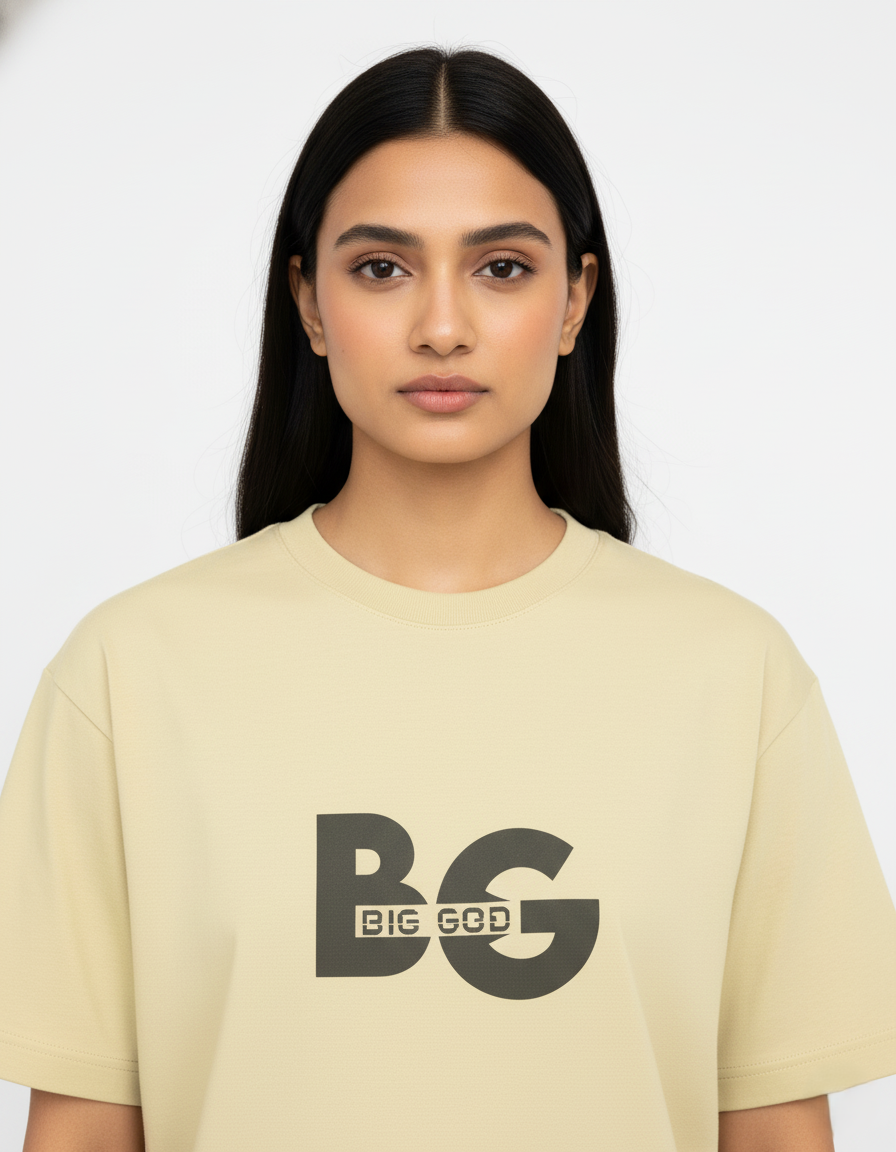 Woman wearing a beige t-shirt with 'BIG GOD' printed