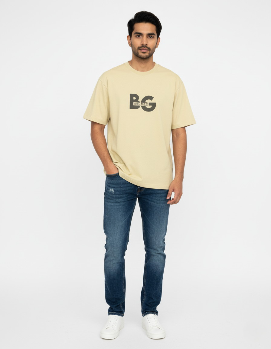 Man wearing a beige t-shirt with a logo